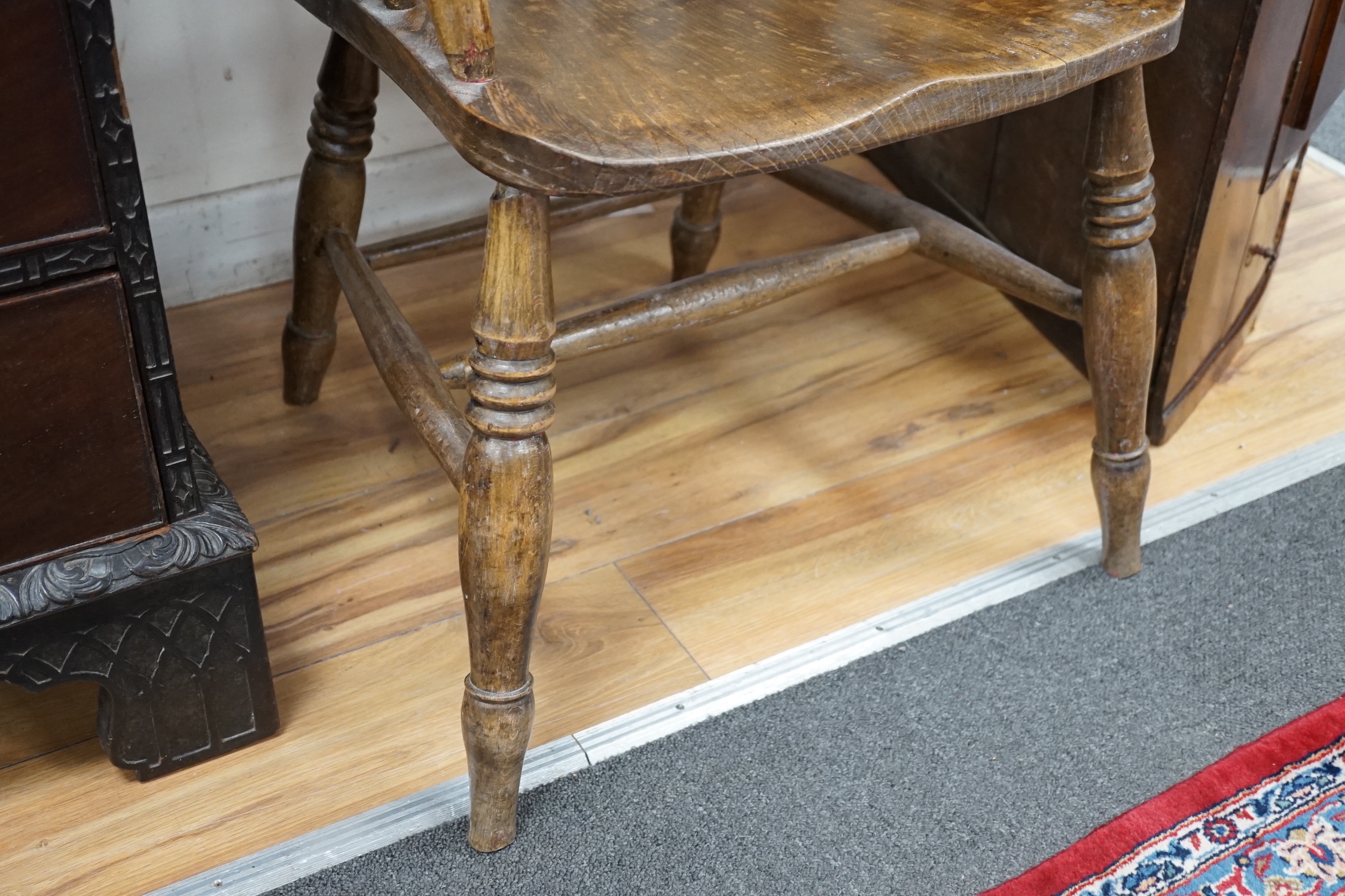 A Victorian elm and beech lathe back elbow chair, width 61cm, depth 48cm, height 112cm
